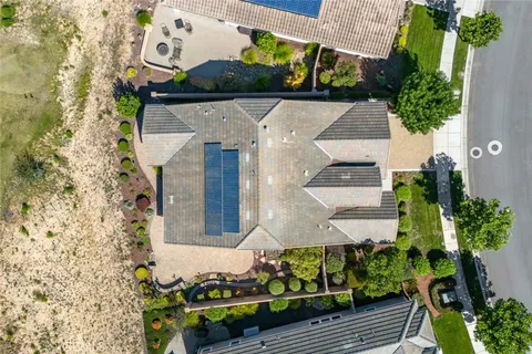 a view of a backyard with sitting area