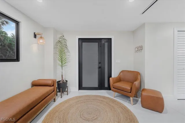 a bedroom with furniture and a chair