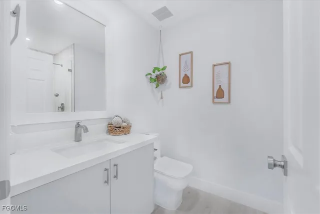 a bathroom with a shower and a glass door