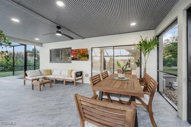 a view of a house with a big yard plants and large trees