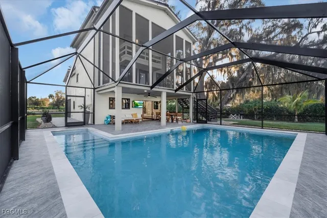 an empty room with furniture and a large window