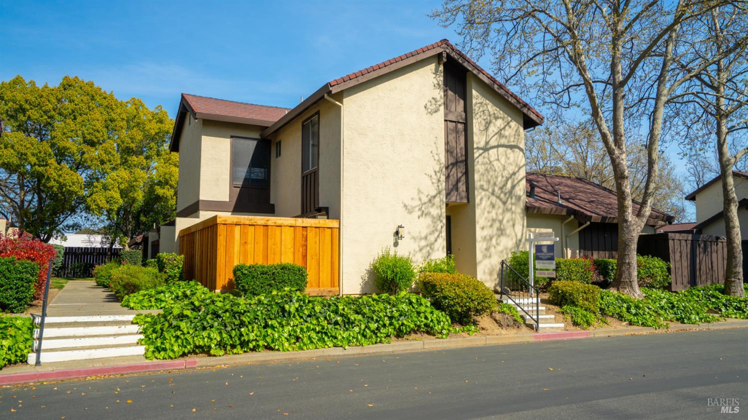 149 Fairoaks Drive Vacaville, CA 95688 - Photo 1 of 1 a front view of a house with a yard and fountain
