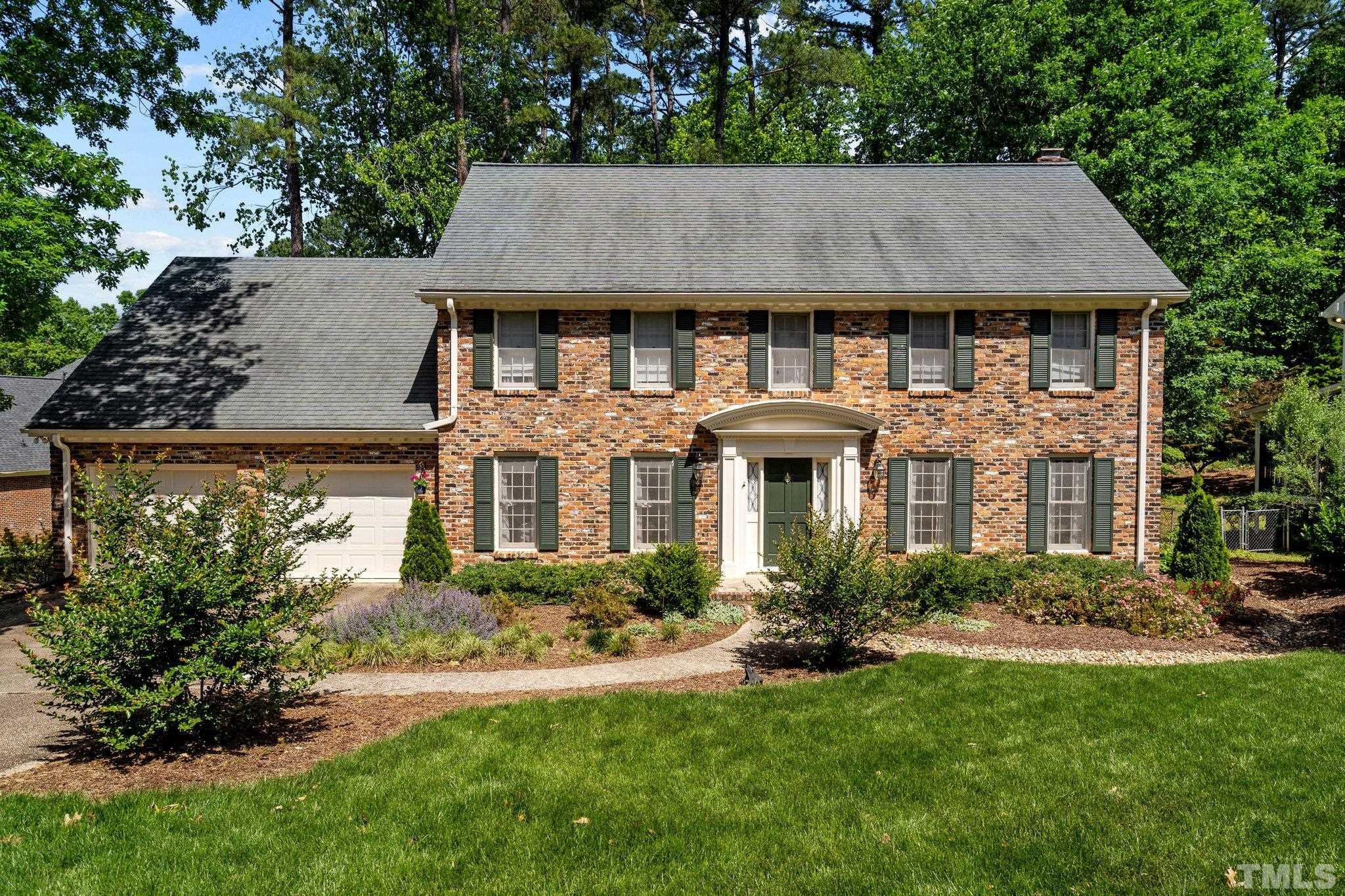 7805 Harps Mill Road Raleigh, NC 27615 - Photo 1 of 57 a aerial view of a house with yard and green space