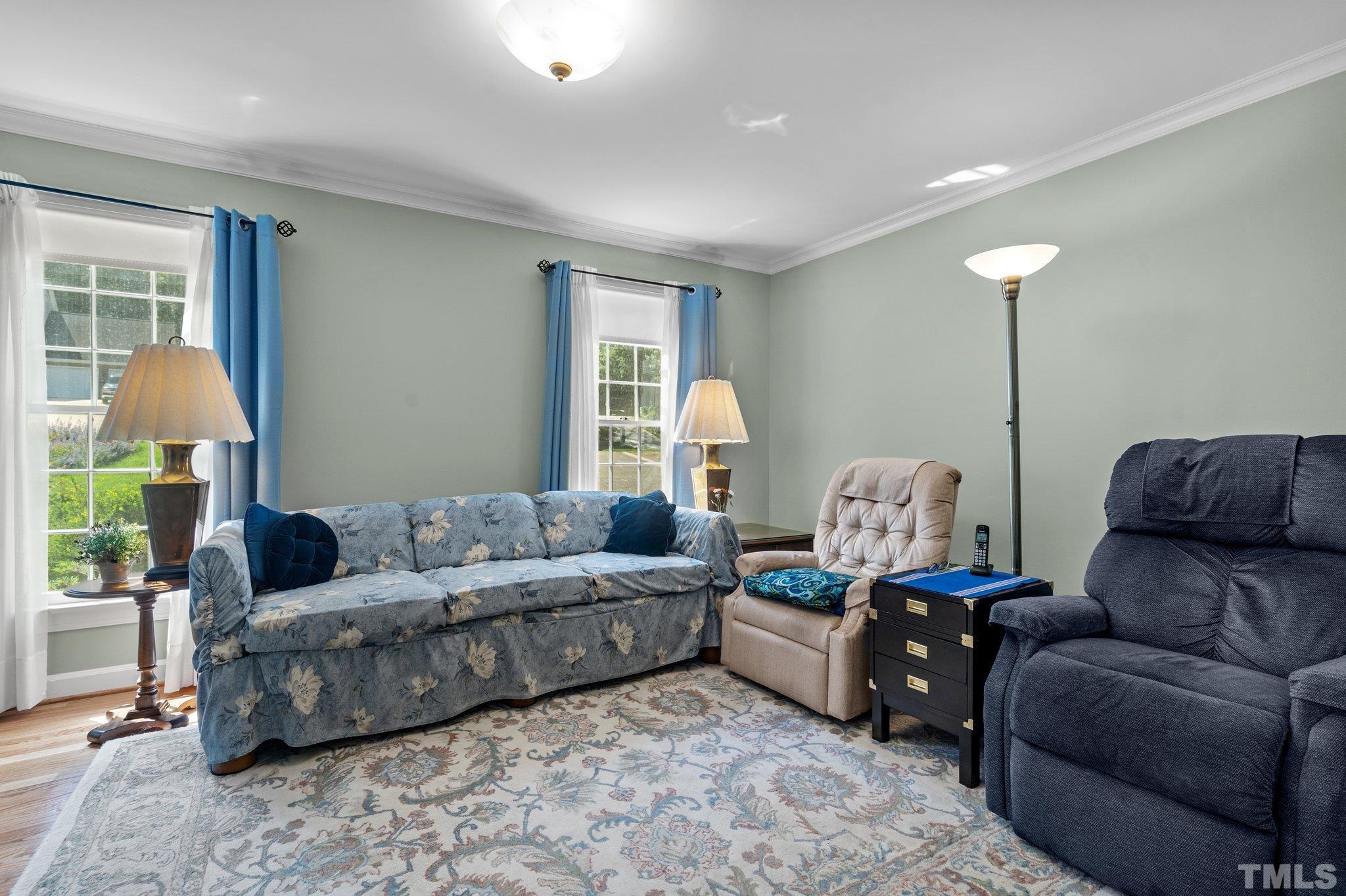 7805 Harps Mill Road Raleigh, NC 27615 - Photo 11 of 57 a living room with furniture and a window