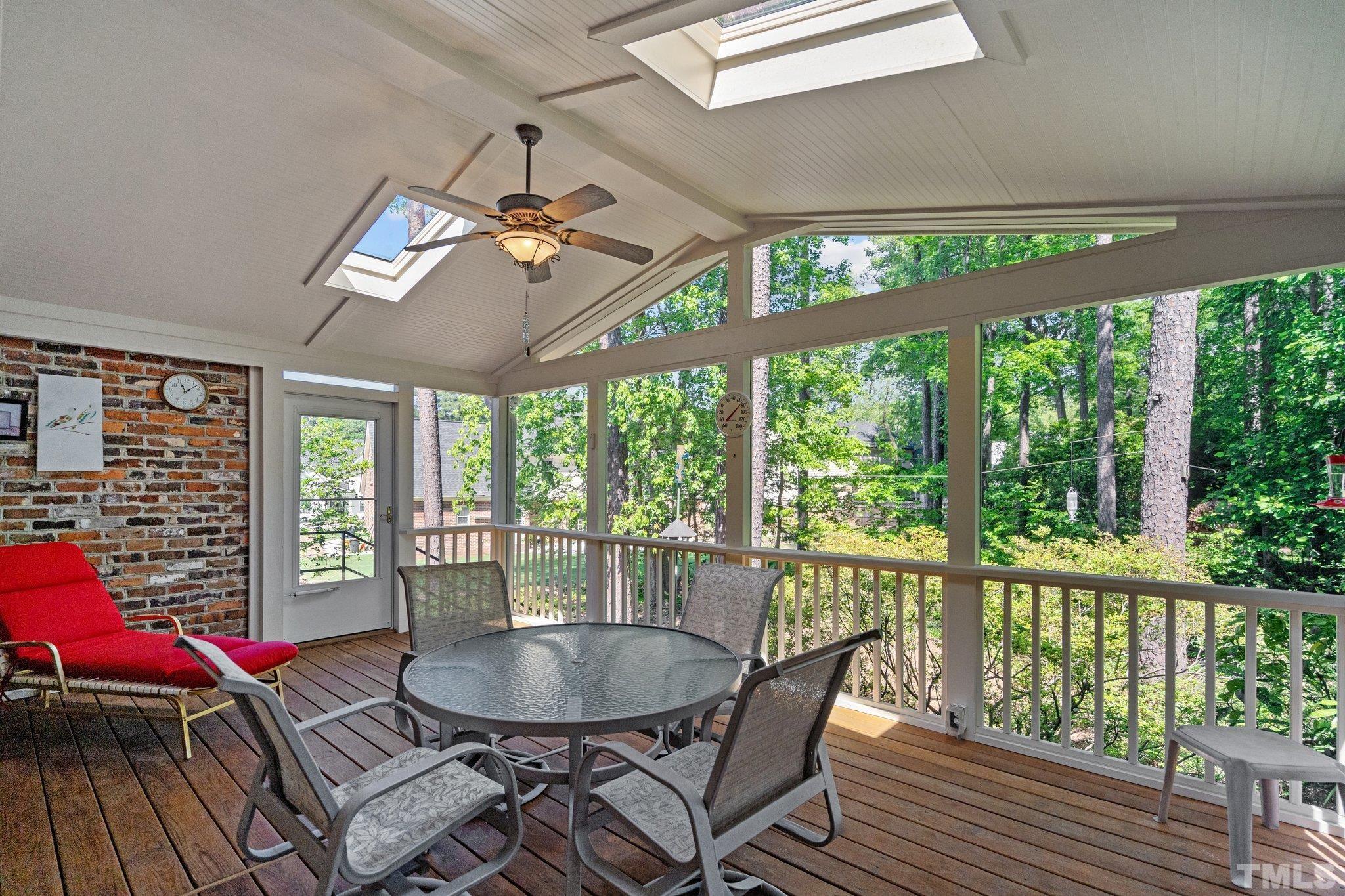 7805 Harps Mill Road Raleigh, NC 27615 - Photo 43 of 57 a dining room with furniture a chandelier and window