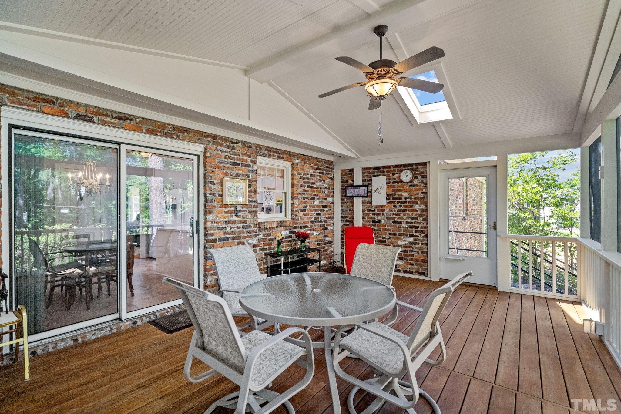 7805 Harps Mill Road Raleigh, NC 27615 - Photo 44 of 57 a view of a dining room with furniture window and wooden floor