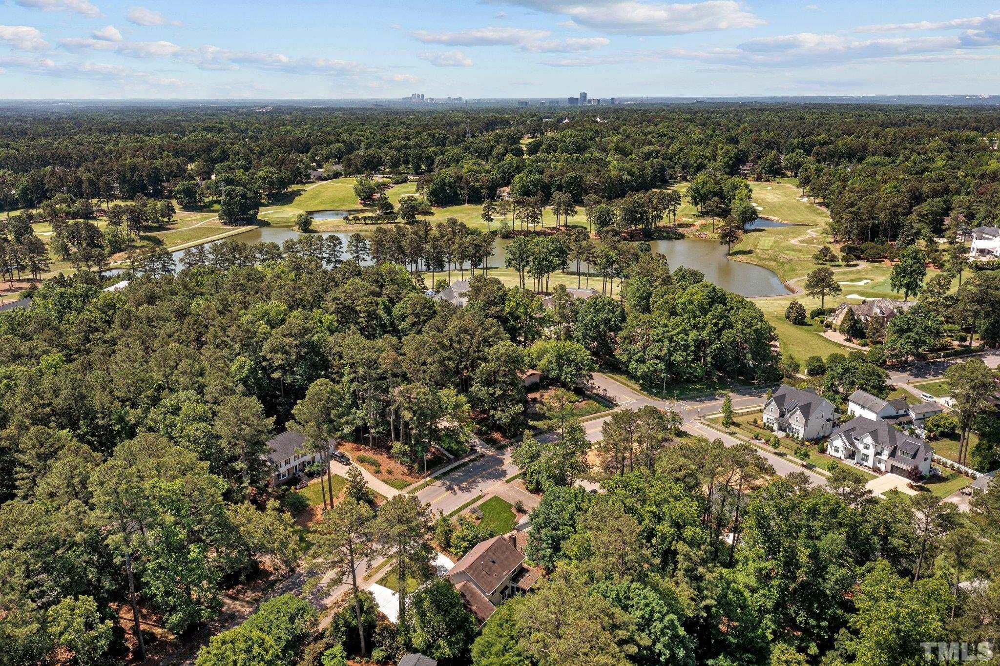 7805 Harps Mill Road Raleigh, NC 27615 - Photo 57 of 57 an aerial view of residential building with green space