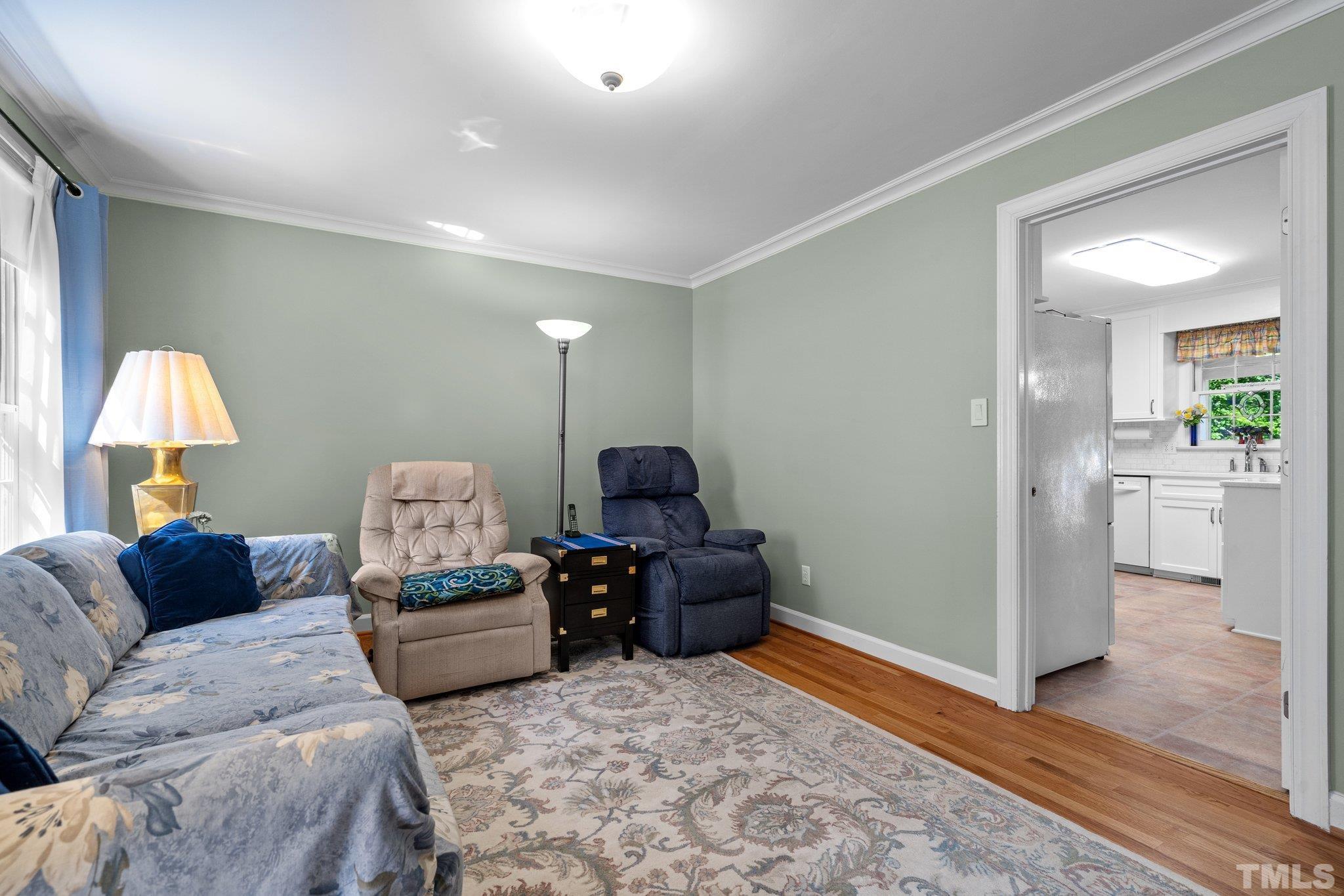 7805 Harps Mill Road Raleigh, NC 27615 - Photo 10 of 57 a living room with furniture and a window