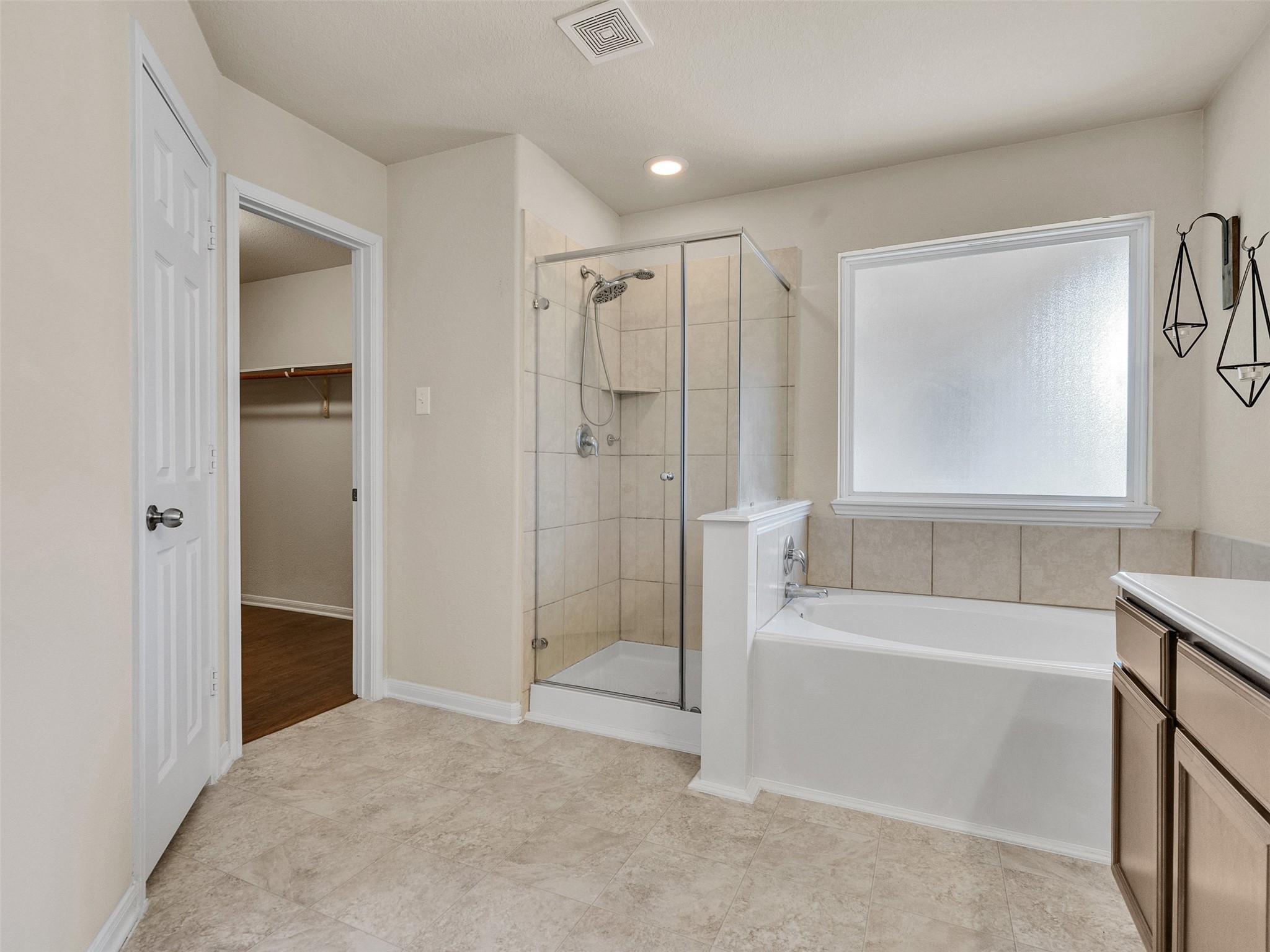 20043 Sunshine Ridge Lane Cypress, TX 77429 - Photo 9 of 16 a bathroom with a tub shower and a sink
