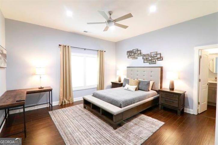 1673 Fairway Drive Mableton, GA 30126 - Photo 12 of 27 a bedroom with a bed and wooden floor