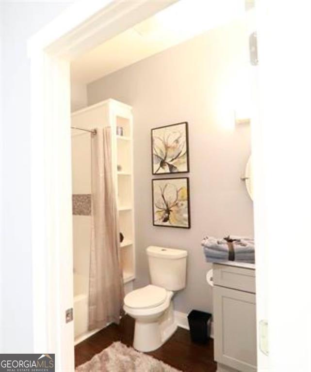 1673 Fairway Drive Mableton, GA 30126 - Photo 14 of 27 a bathroom with a toilet a sink and a mirror