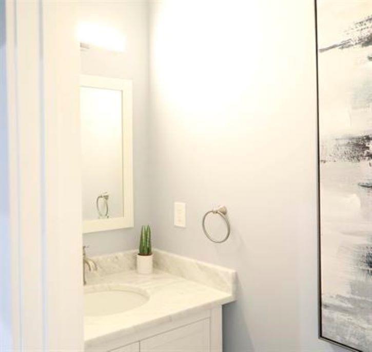 1673 Fairway Drive Mableton, GA 30126 - Photo 26 of 27 a bathroom with a sink and a mirror