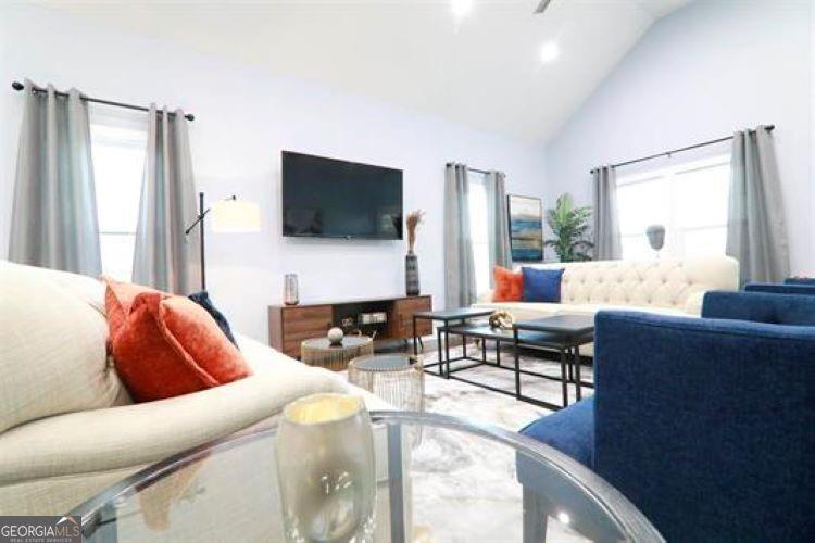 1673 Fairway Drive Mableton, GA 30126 - Photo 5 of 27 a living room with fireplace furniture and a flat screen tv