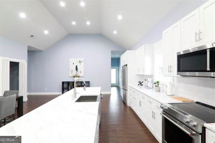 1673 Fairway Drive Mableton, GA 30126 - Photo 8 of 27 a large white kitchen with a large window