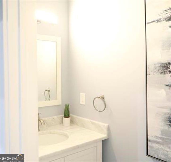 1673 Fairway Drive Mableton, GA 30126 - Photo 10 of 27 a bathroom with a sink and a mirror