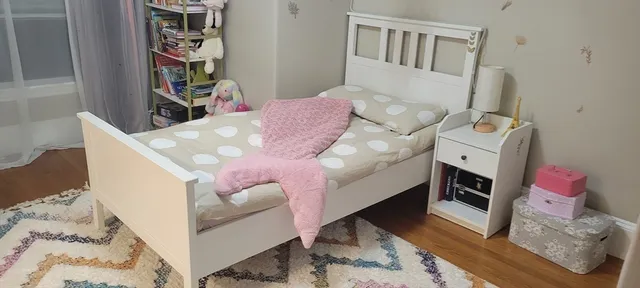 a bedroom with furniture and a wooden floor