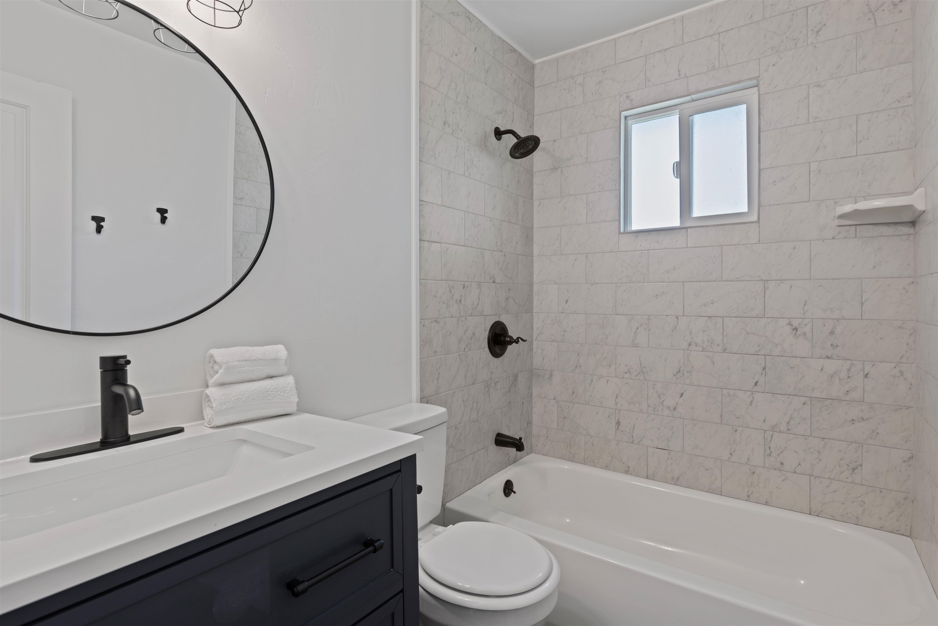 547 East 12th Street Rifle, CO 81650 - Photo 13 of 26 a bathroom with a sink a toilet and shower