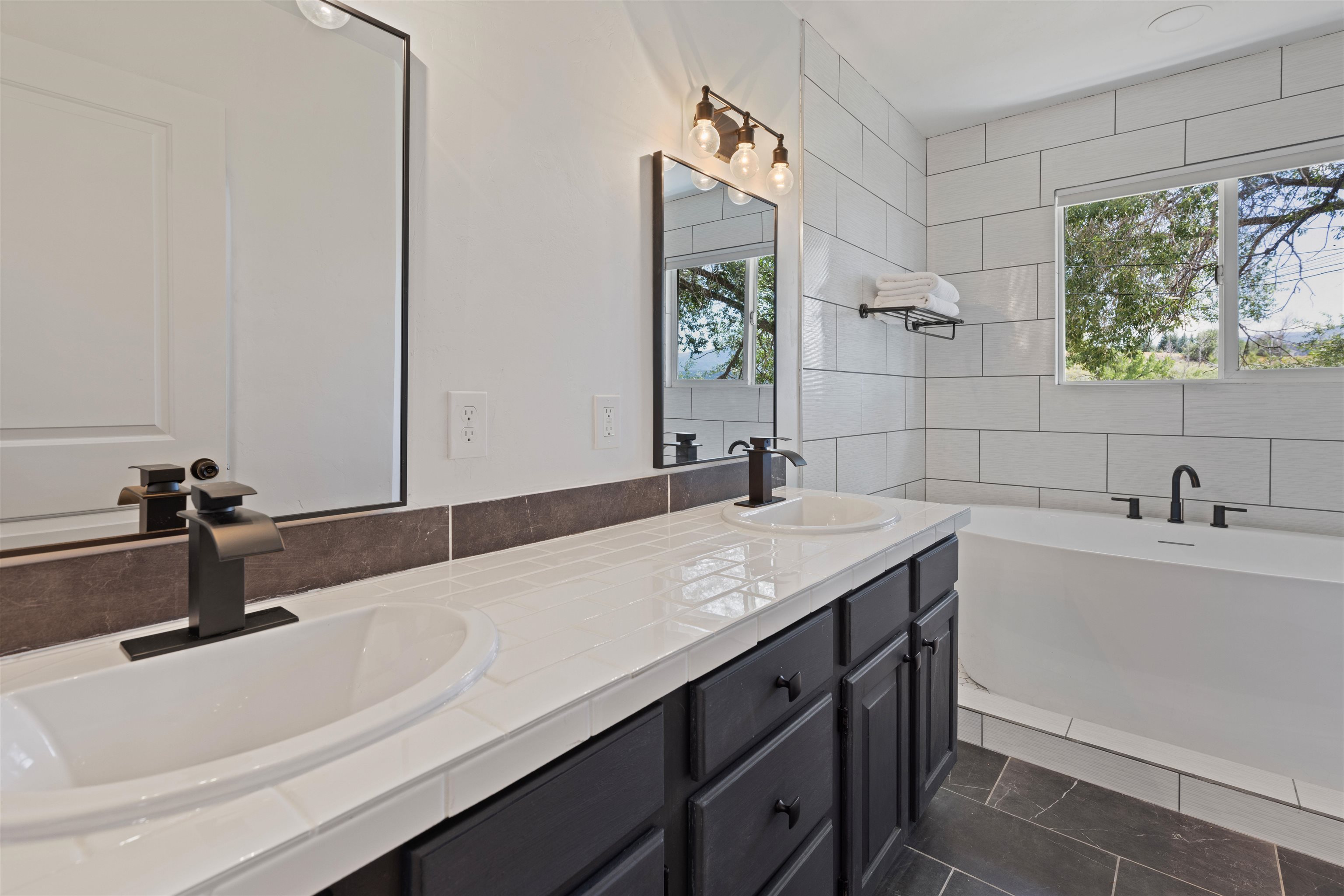 547 East 12th Street Rifle, CO 81650 - Photo 15 of 26 a bathroom with a sink and a bathtub
