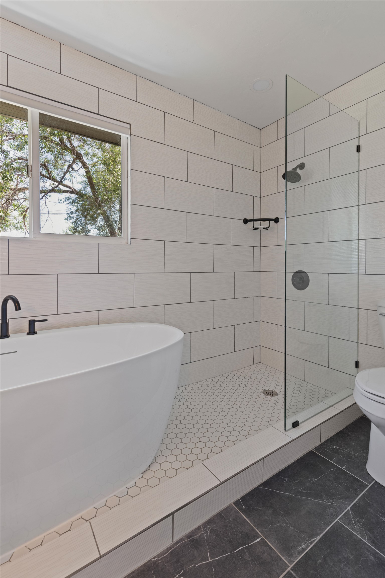 547 East 12th Street Rifle, CO 81650 - Photo 16 of 26 a bathroom with a bathtub and shower