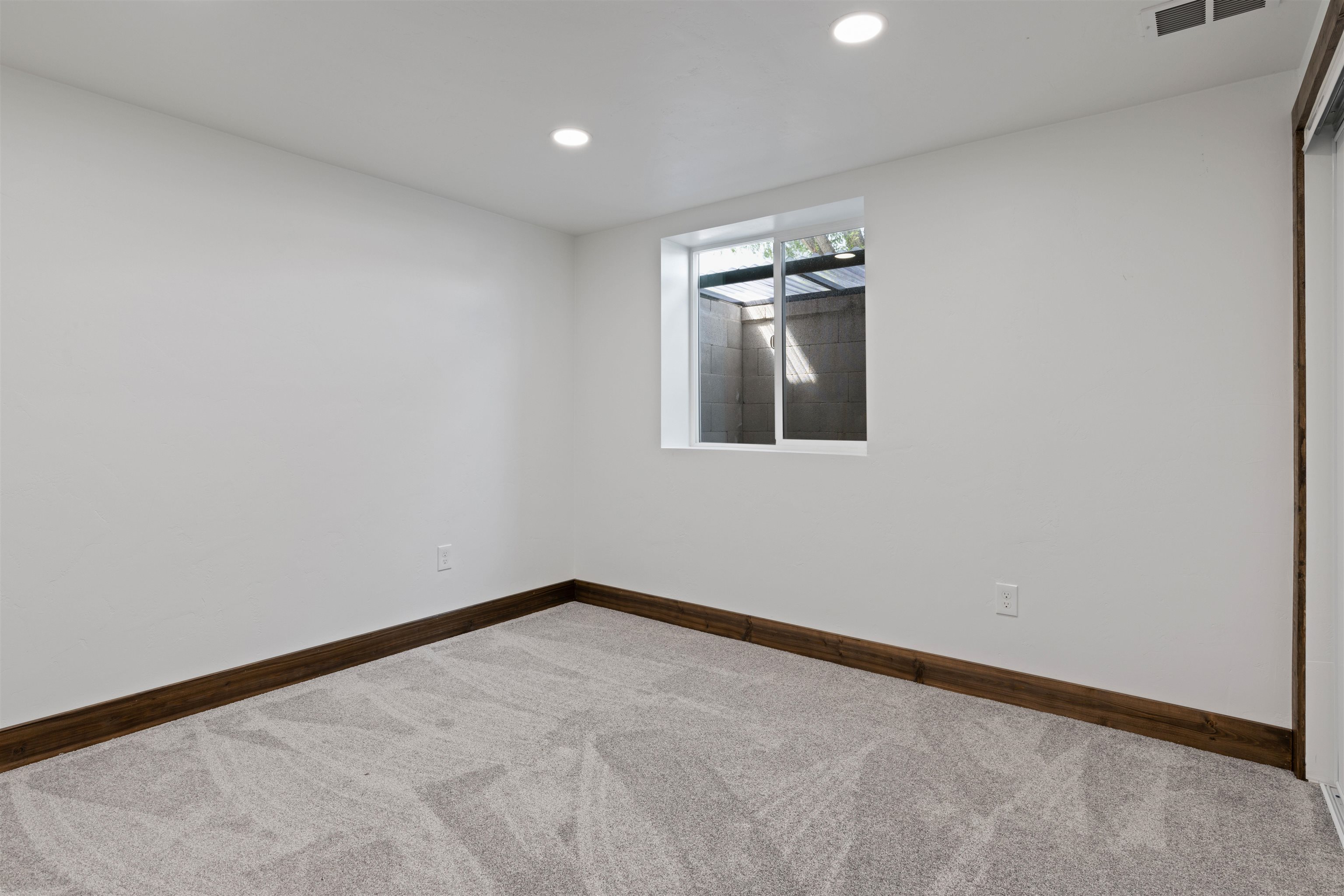 547 East 12th Street Rifle, CO 81650 - Photo 20 of 26 an empty room with a empty space and windows
