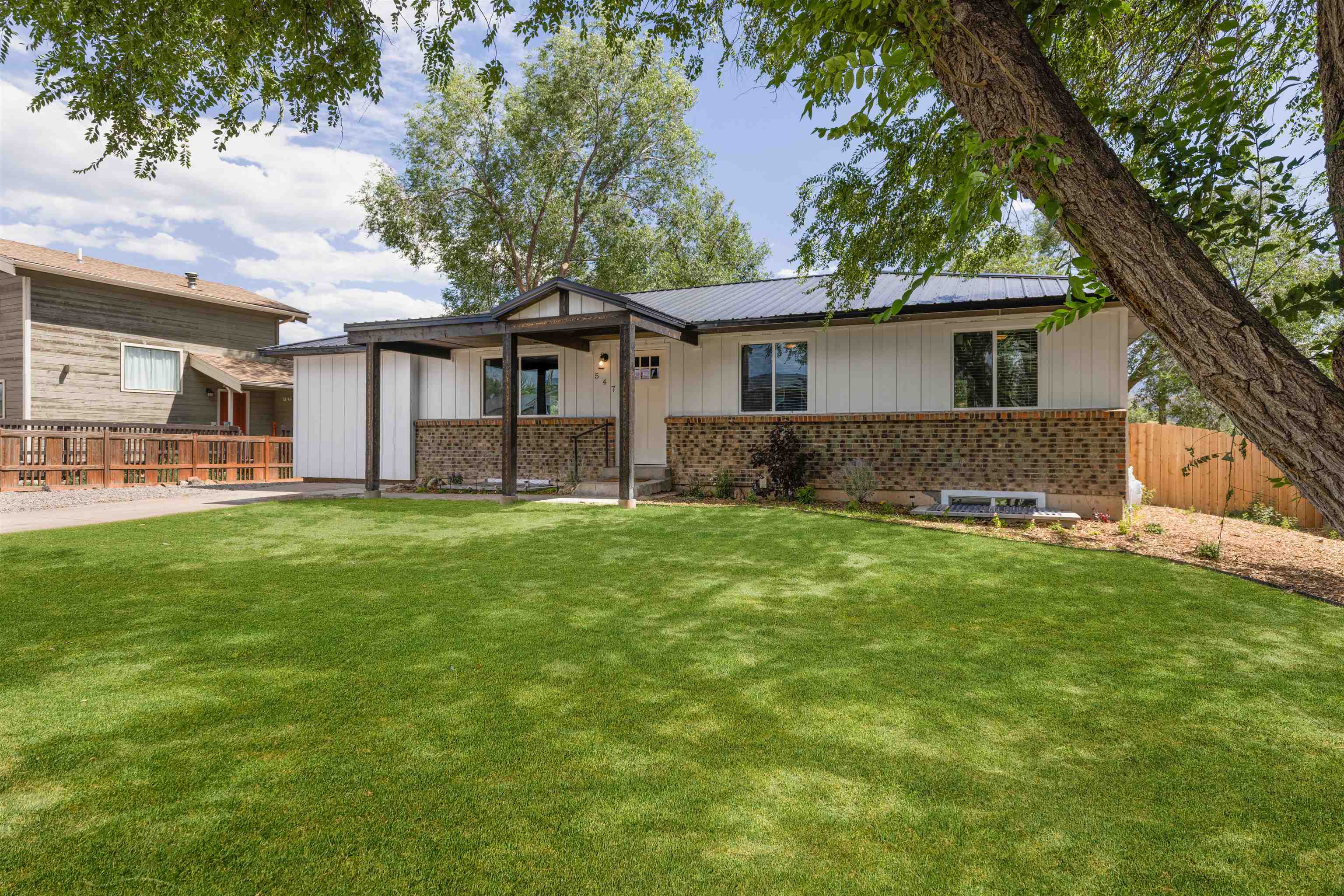 547 East 12th Street Rifle, CO 81650 - Photo 2 of 26 a front view of house with yard and green space