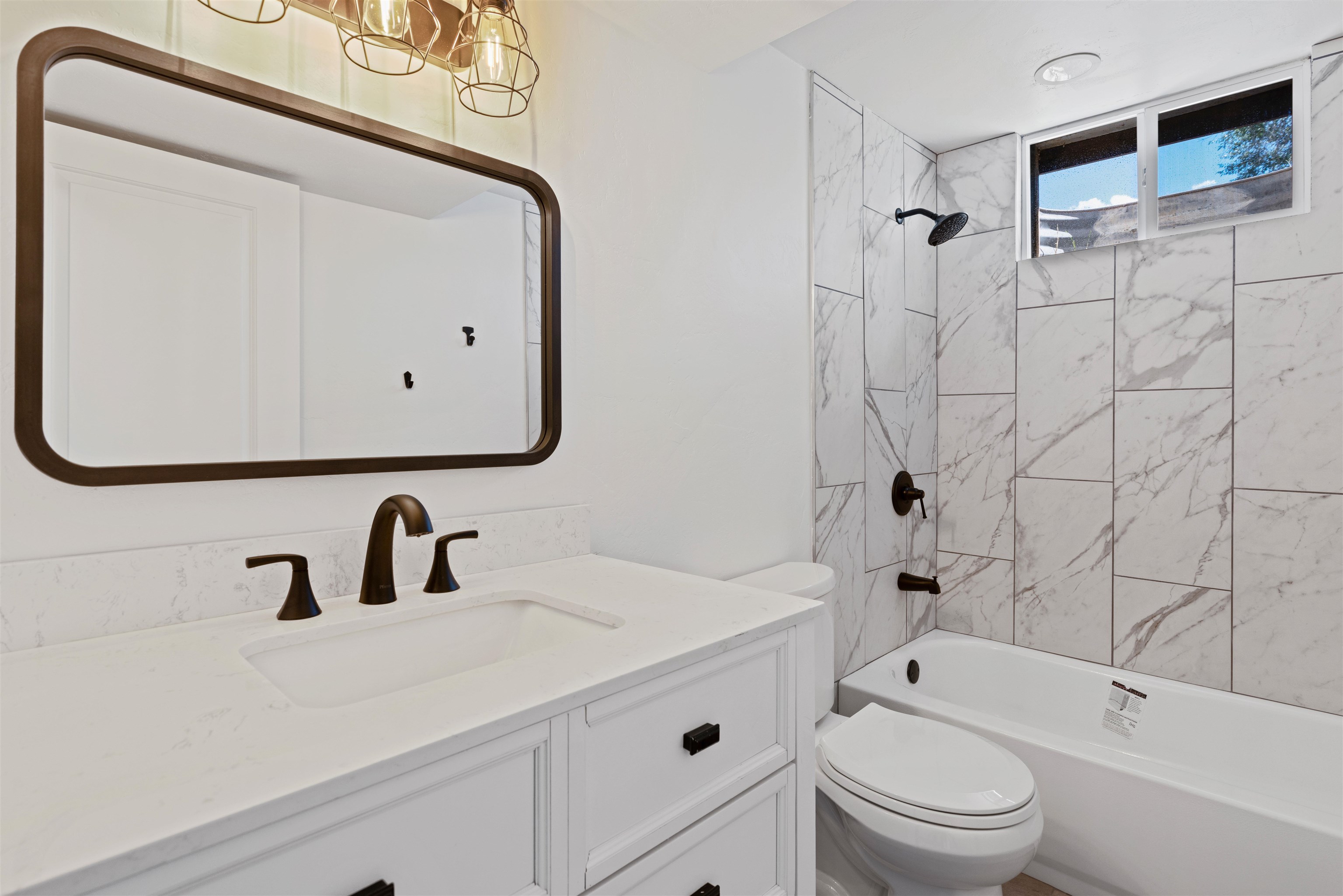 547 East 12th Street Rifle, CO 81650 - Photo 21 of 26 a bathroom with a sink a toilet and shower