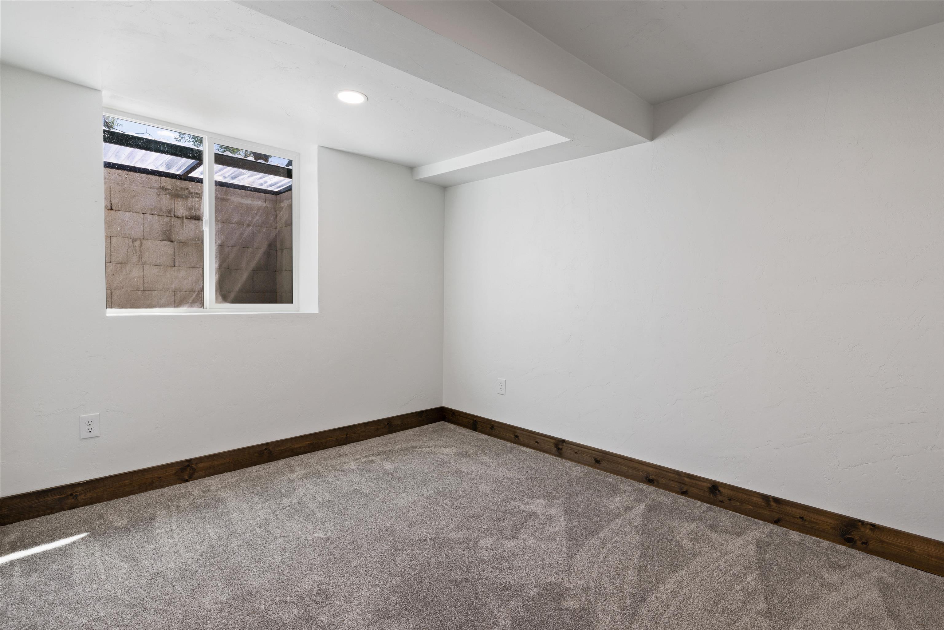 547 East 12th Street Rifle, CO 81650 - Photo 22 of 26 an empty room with windows