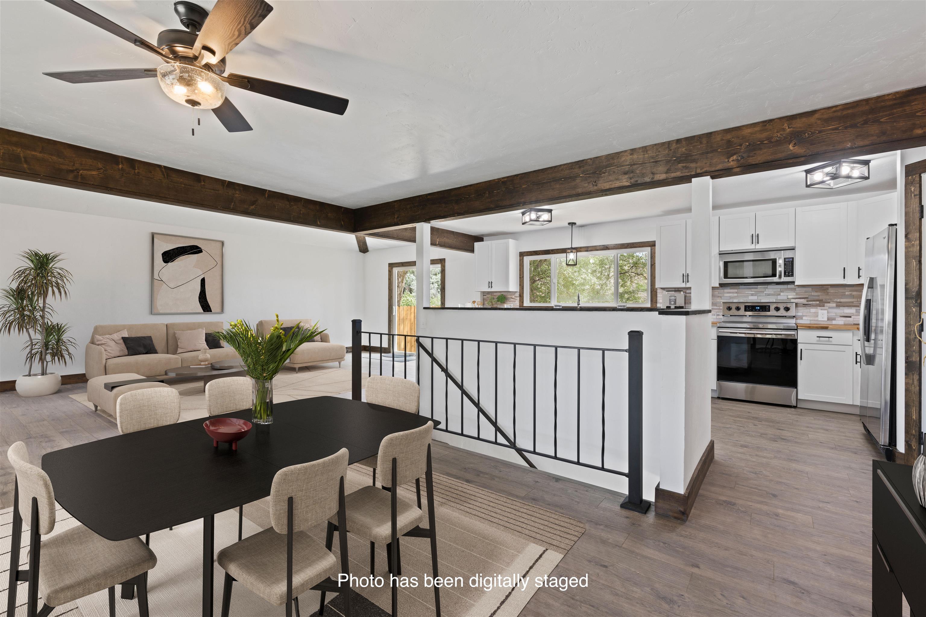 547 East 12th Street Rifle, CO 81650 - Photo 6 of 26 a living room with furniture and kitchen view
