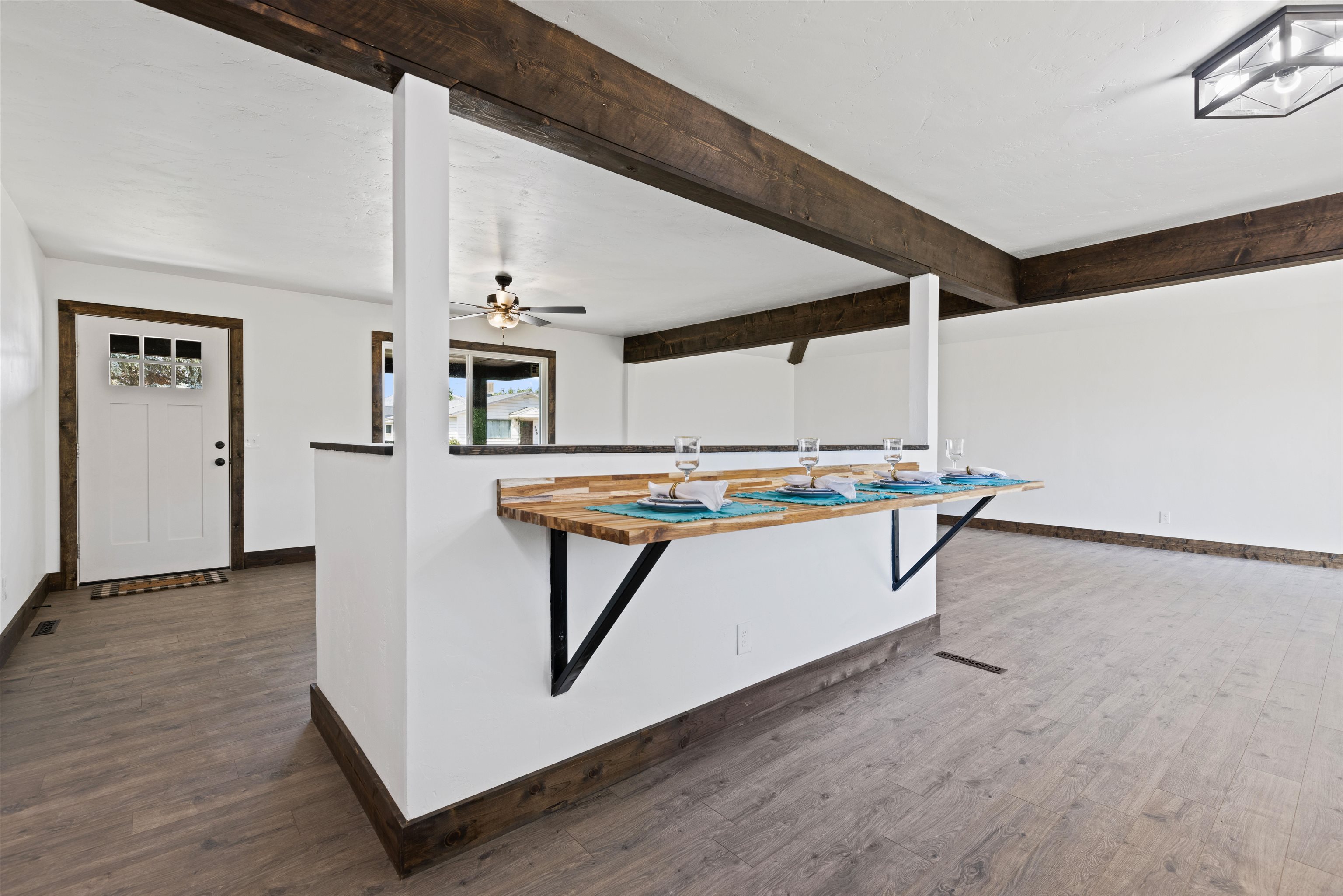 547 East 12th Street Rifle, CO 81650 - Photo 7 of 26 a living room with a table and windows
