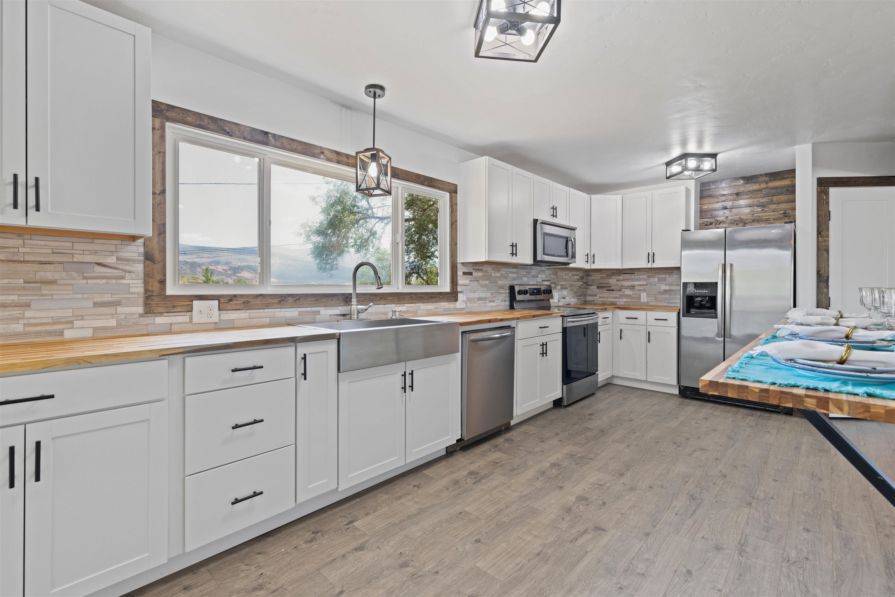 547 East 12th Street Rifle, CO 81650 - Photo 8 of 26 a kitchen with a sink window and cabinets
