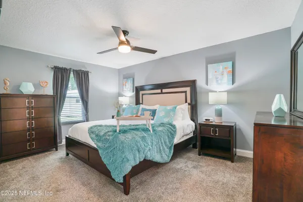 a bed room with a bed and a window