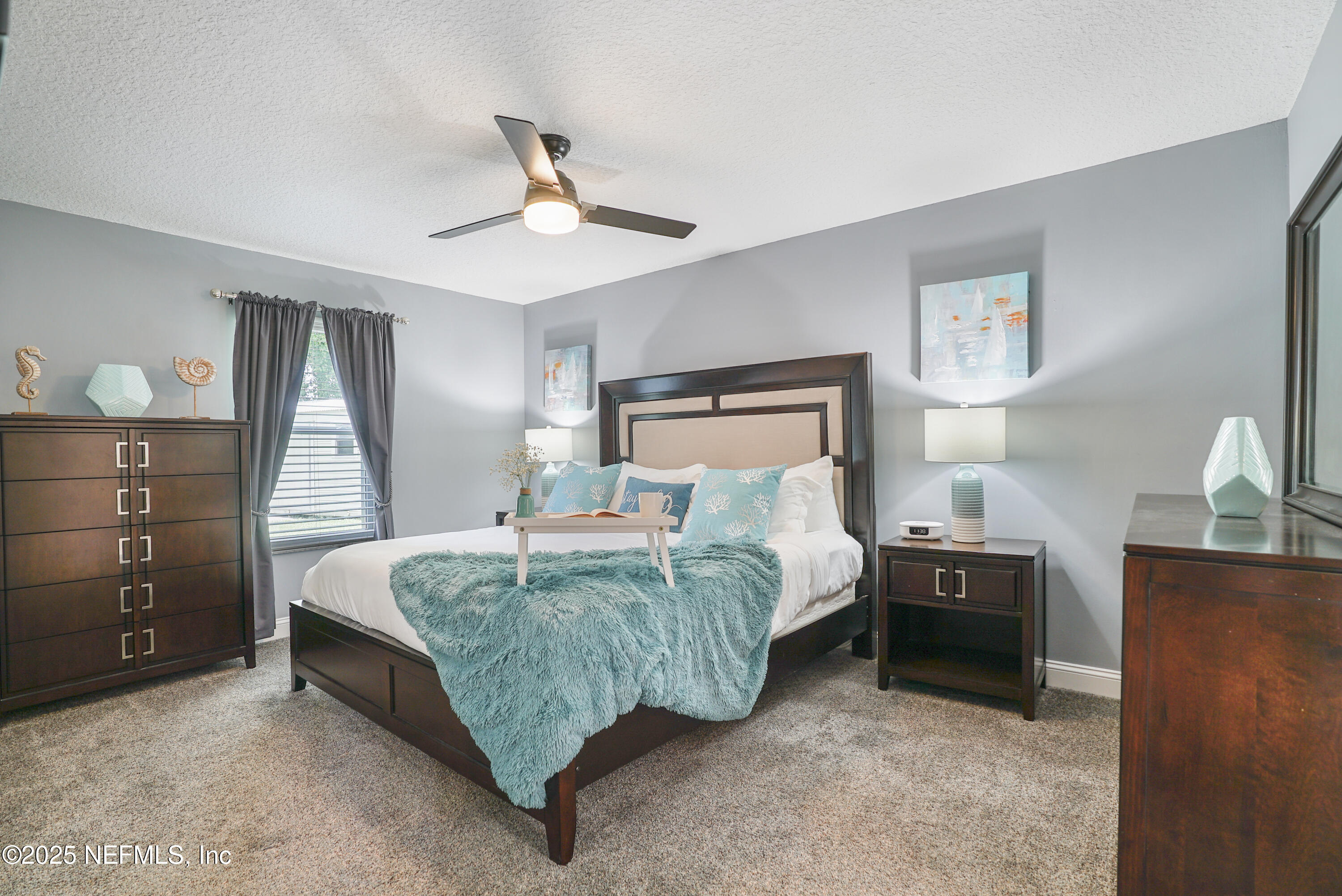 4041 Pine Run Circle St. Augustine, FL 32086 - Photo 11 of 57 a bedroom with a bed and a chandelier