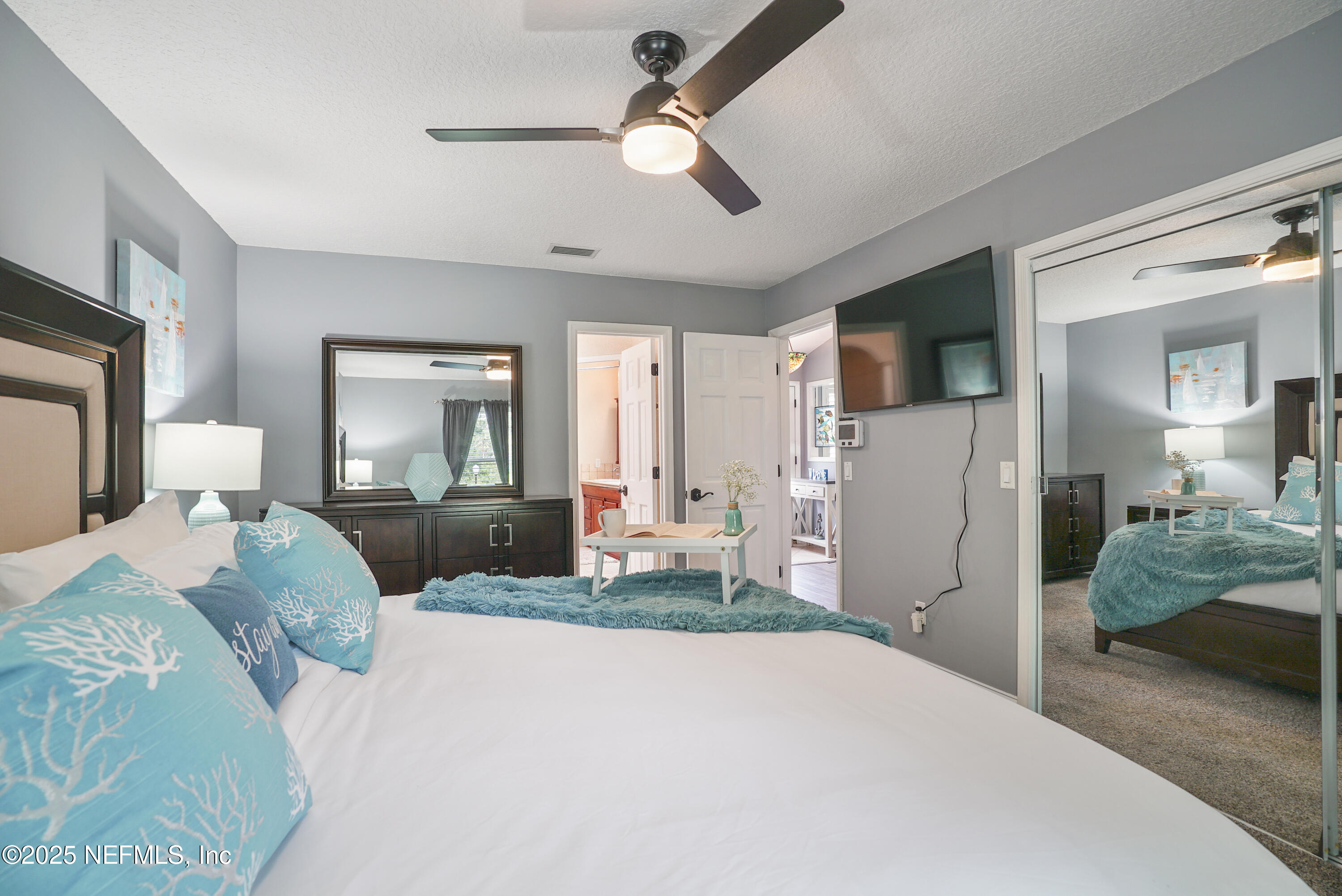 4041 Pine Run Circle St. Augustine, FL 32086 - Photo 12 of 57 a bedroom with a bed and a television