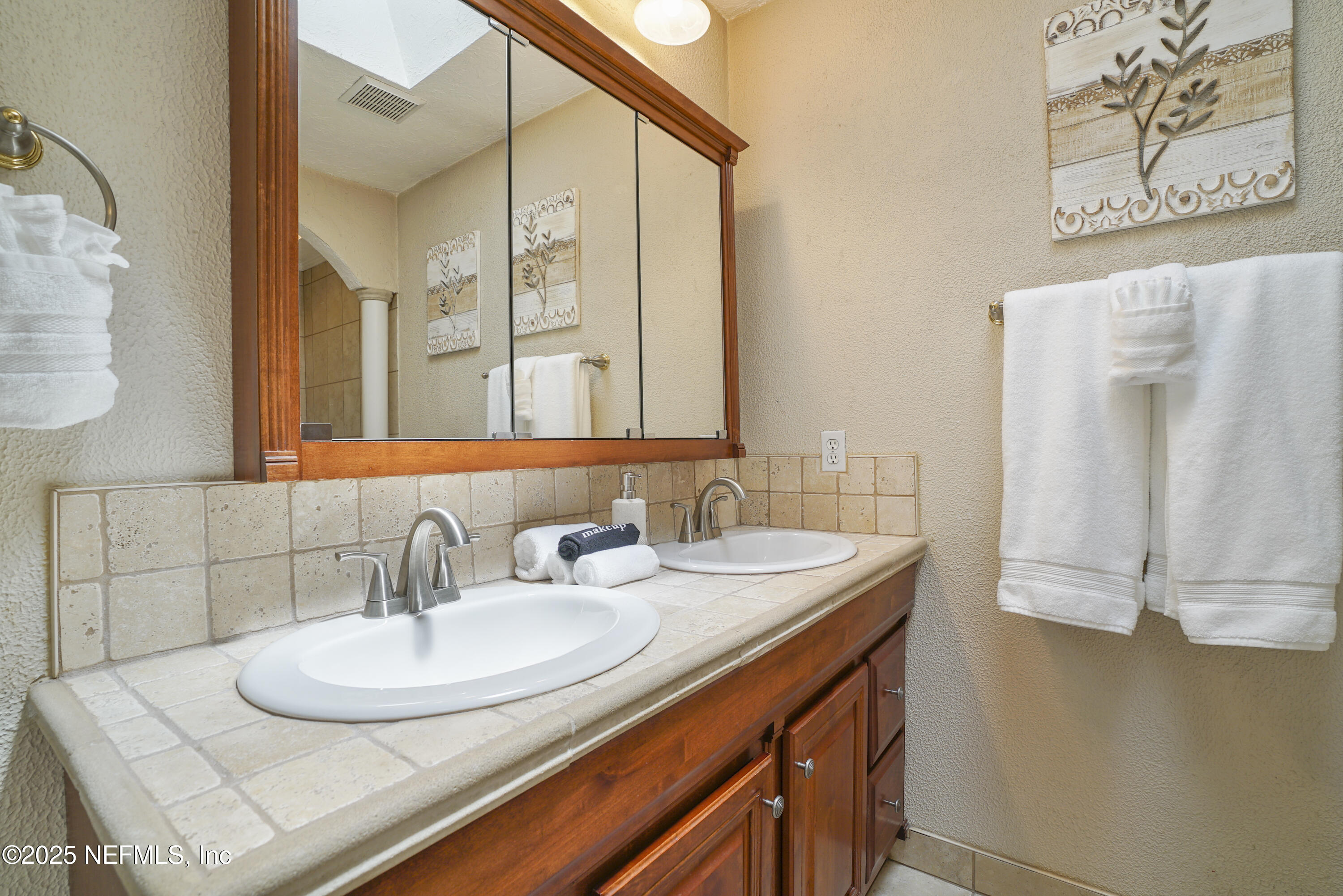 4041 Pine Run Circle St. Augustine, FL 32086 - Photo 15 of 57 a bathroom with a sink and a mirror