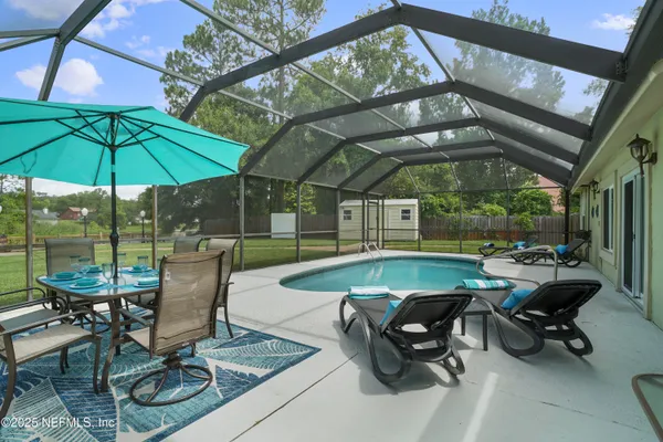 a view of a swimming pool with a patio