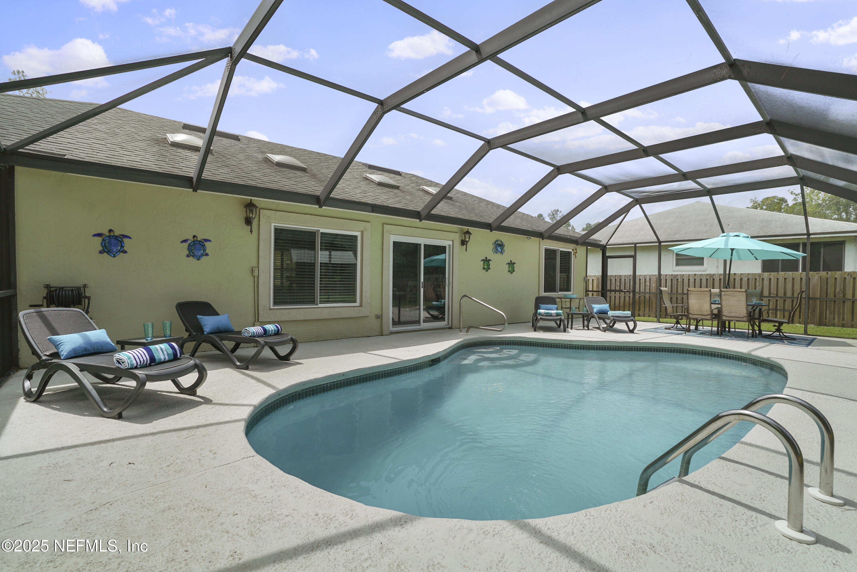 4041 Pine Run Circle St. Augustine, FL 32086 - Photo 19 of 57 a view of a swimming pool with a patio