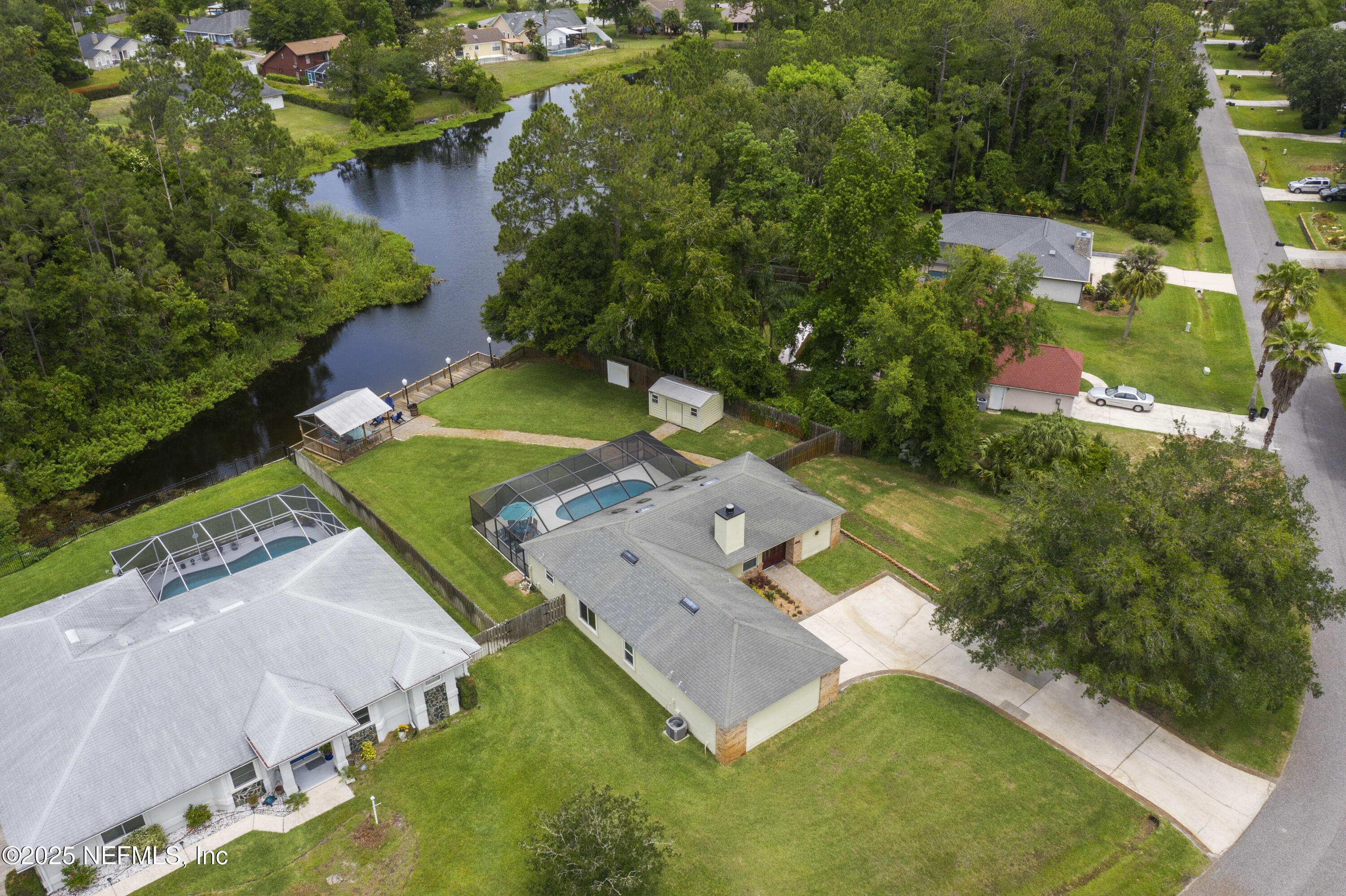4041 Pine Run Circle St. Augustine, FL 32086 - Photo 2 of 57 an aerial view of a house with a garden and swimming pool