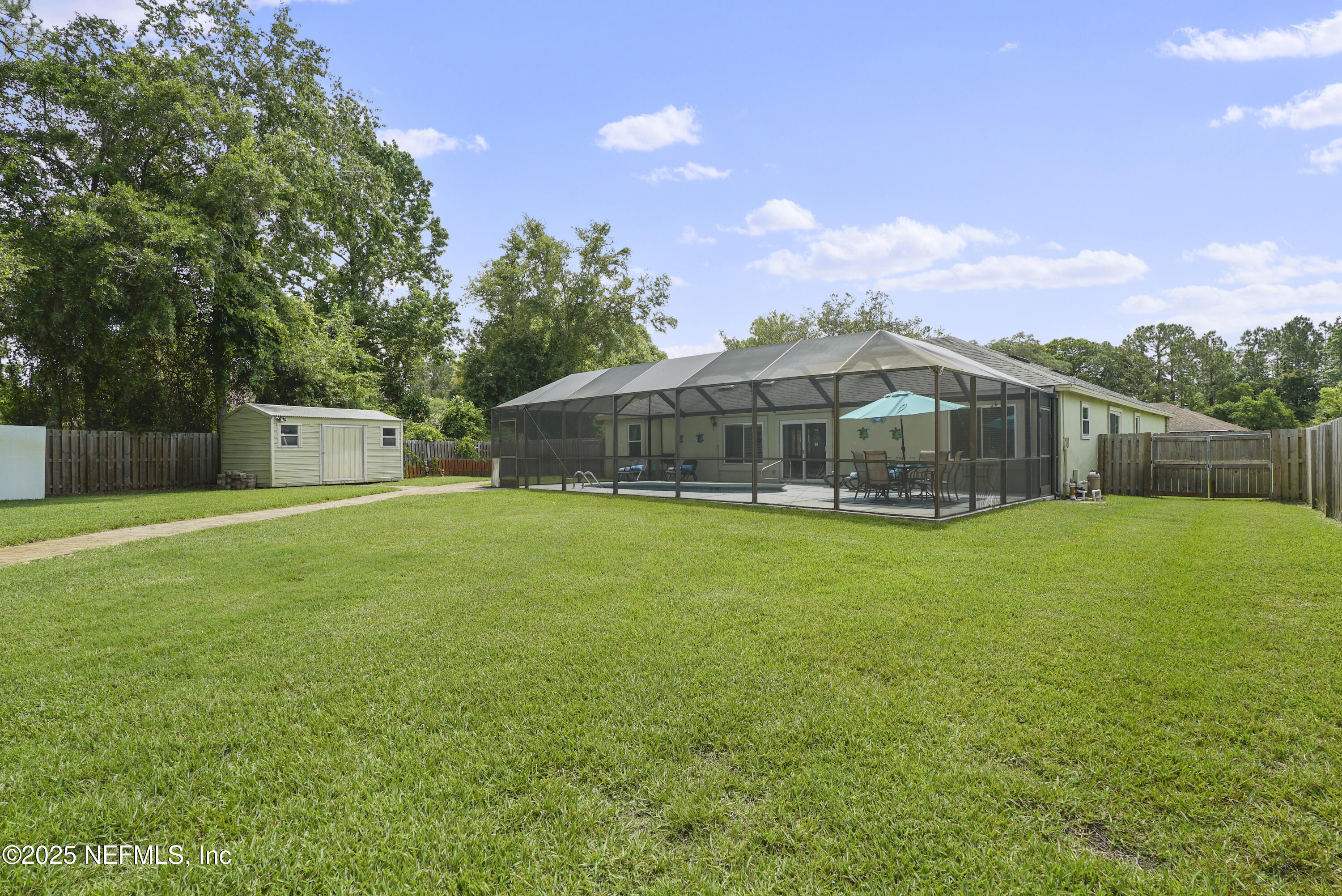 4041 Pine Run Circle St. Augustine, FL 32086 - Photo 21 of 57 a front view of house with yard and outdoor seating