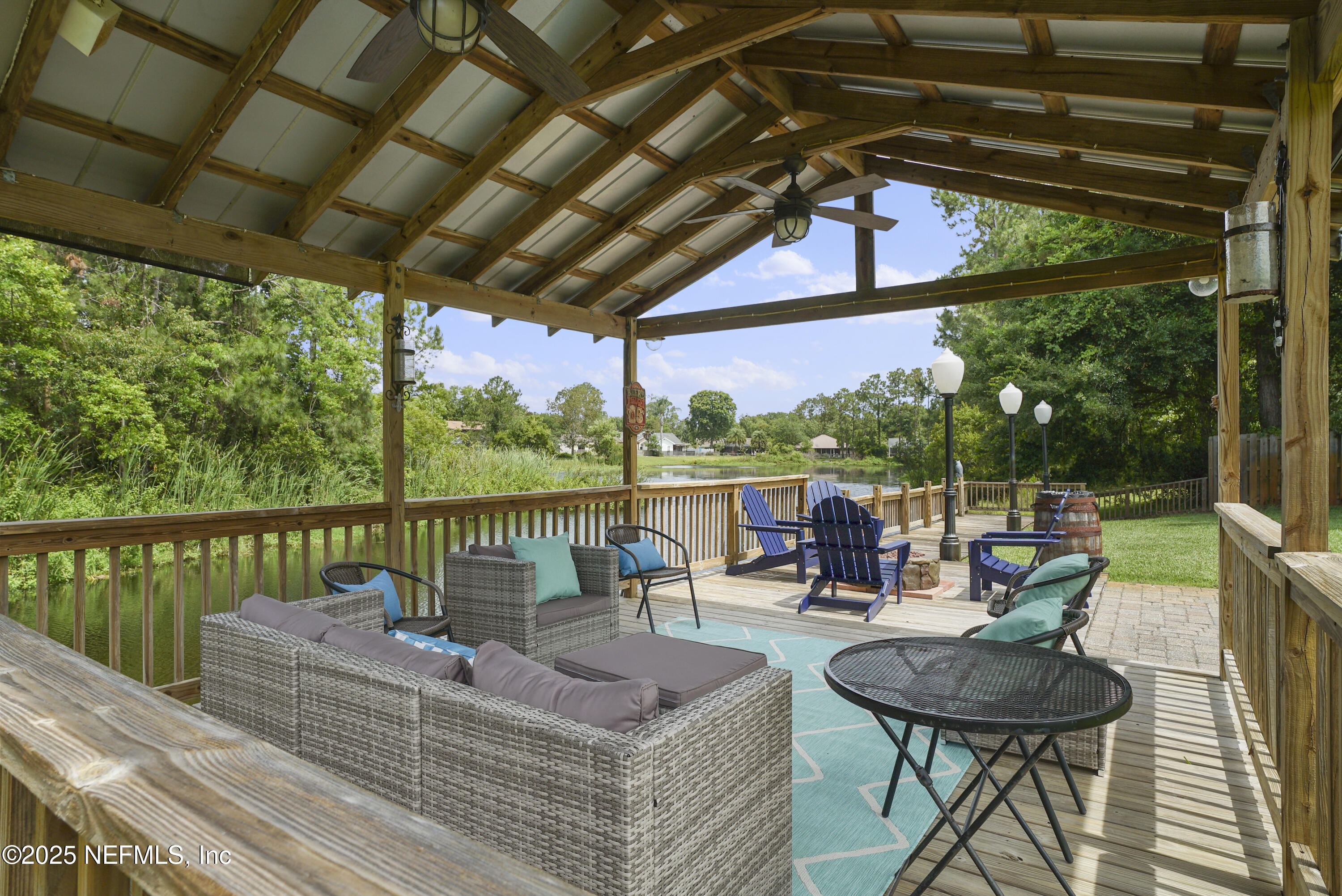 4041 Pine Run Circle St. Augustine, FL 32086 - Photo 22 of 57 a view of a patio with couches chairs and wooden floor