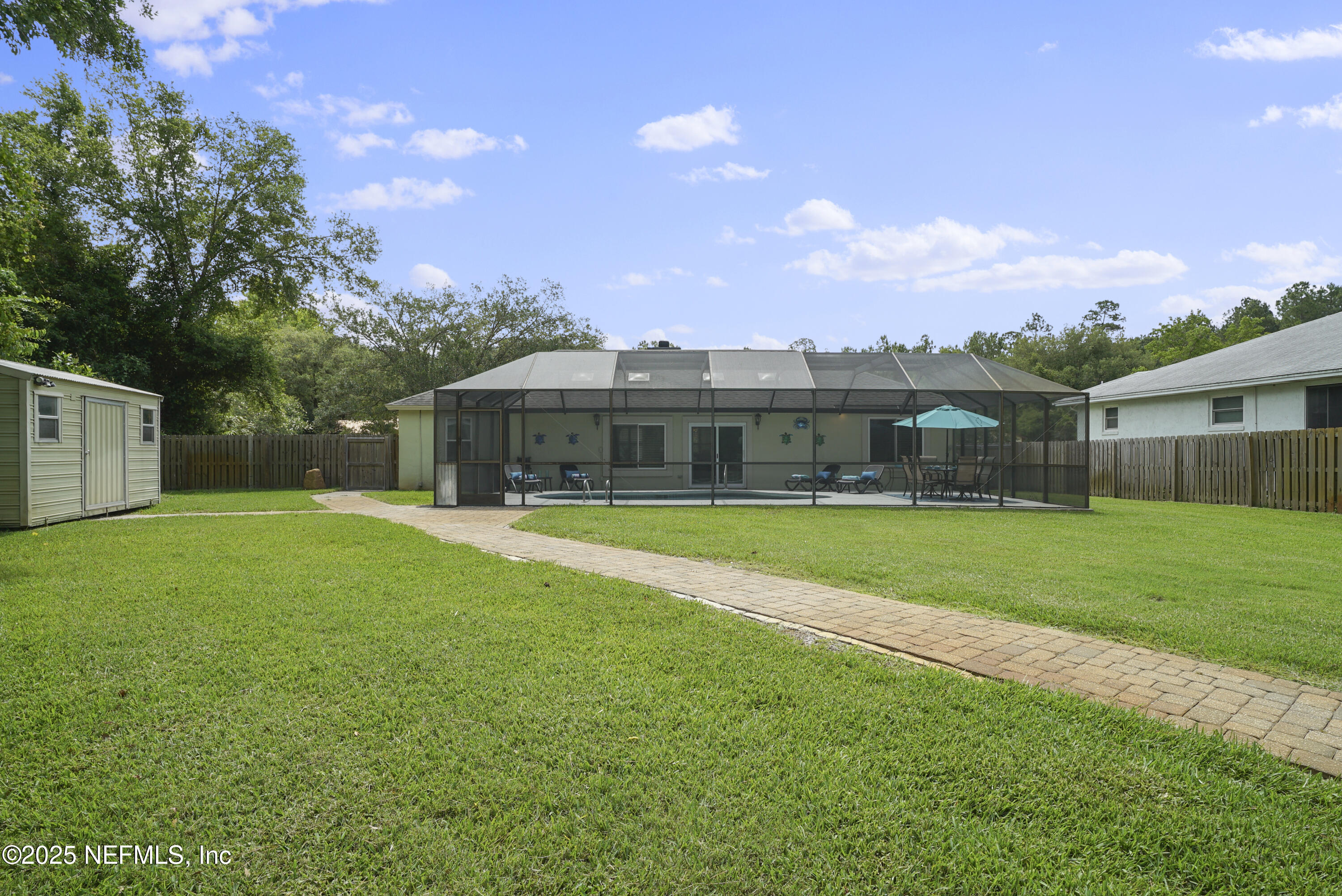 4041 Pine Run Circle St. Augustine, FL 32086 - Photo 27 of 57 a view of a house with a big yard