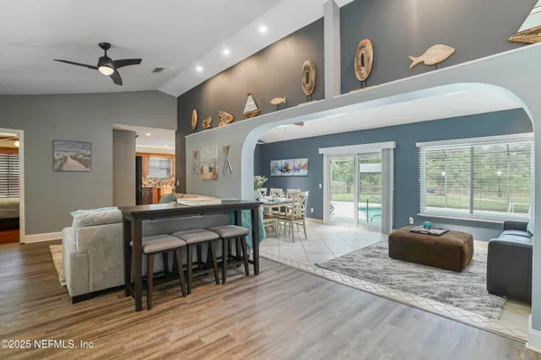 a kitchen with stainless steel appliances granite countertop a stove and a microwave