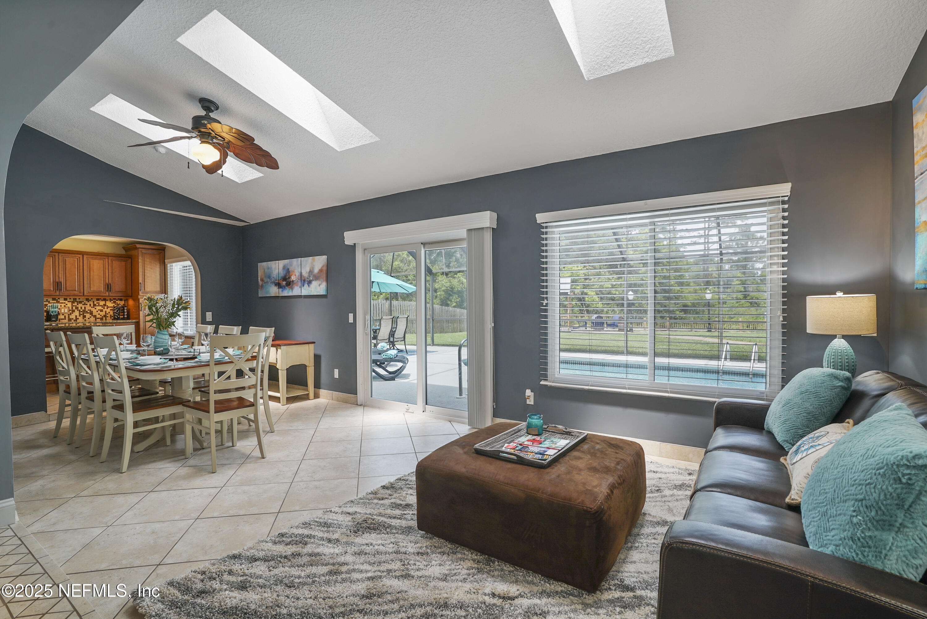 4041 Pine Run Circle St. Augustine, FL 32086 - Photo 31 of 57 a living room with furniture and a large window