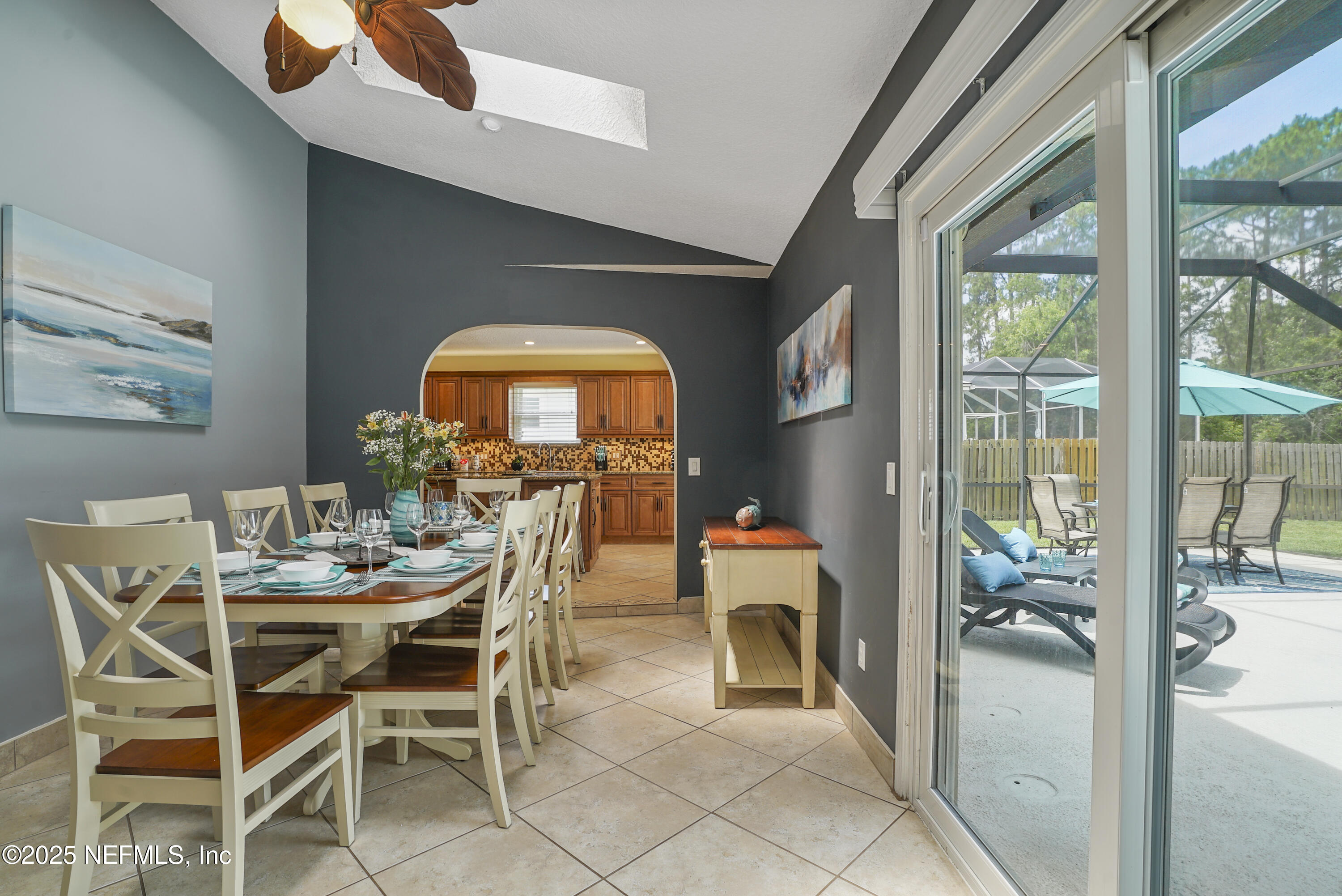 4041 Pine Run Circle St. Augustine, FL 32086 - Photo 32 of 57 a dining room with furniture and a floor to ceiling window