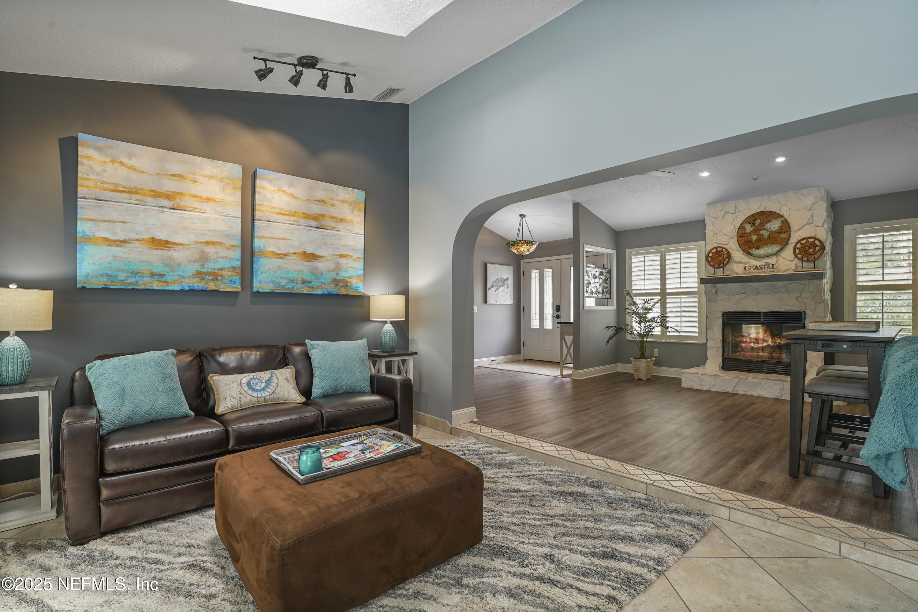 4041 Pine Run Circle St. Augustine, FL 32086 - Photo 33 of 57 a living room with furniture and a fireplace