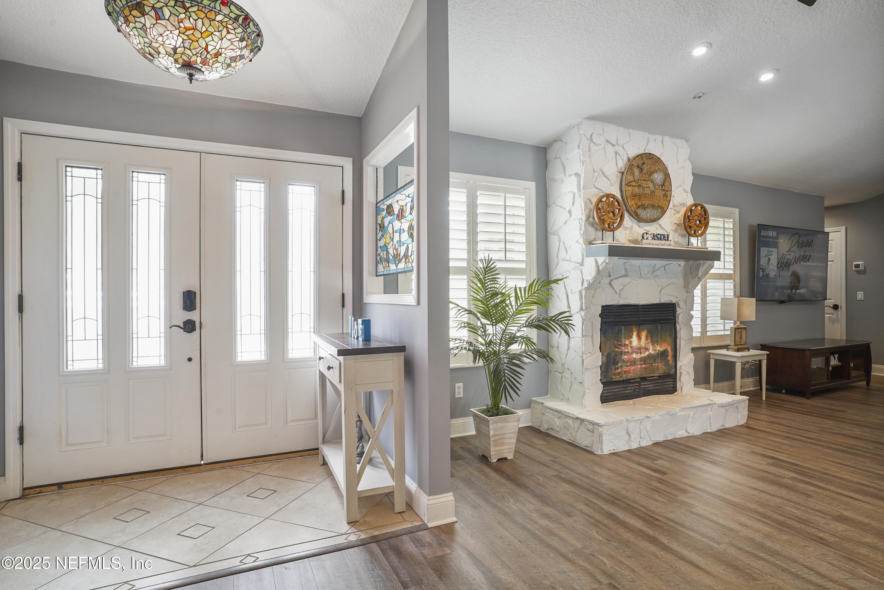 4041 Pine Run Circle St. Augustine, FL 32086 - Photo 46 of 57 a view of an empty room with a fireplace and a window