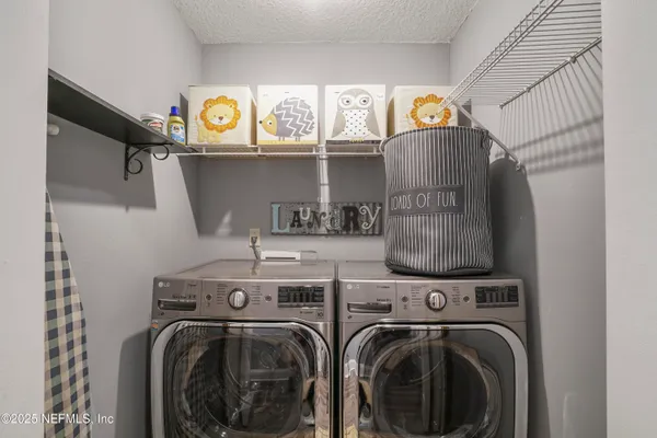 a front view of a house with a garden and yard