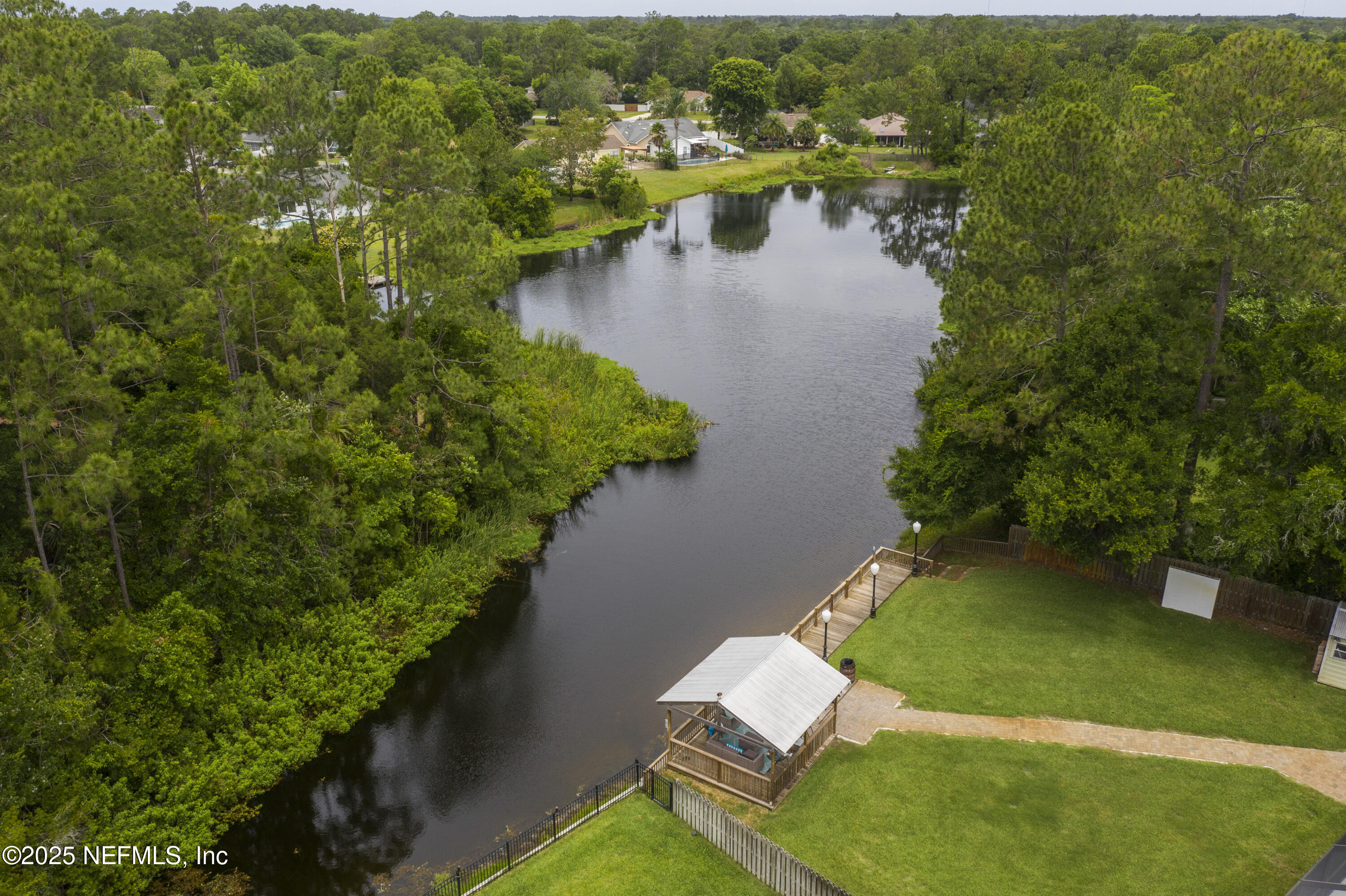 4041 Pine Run Circle St. Augustine, FL 32086 - Photo 5 of 57 an aerial view of residential houses with outdoor space and lake view