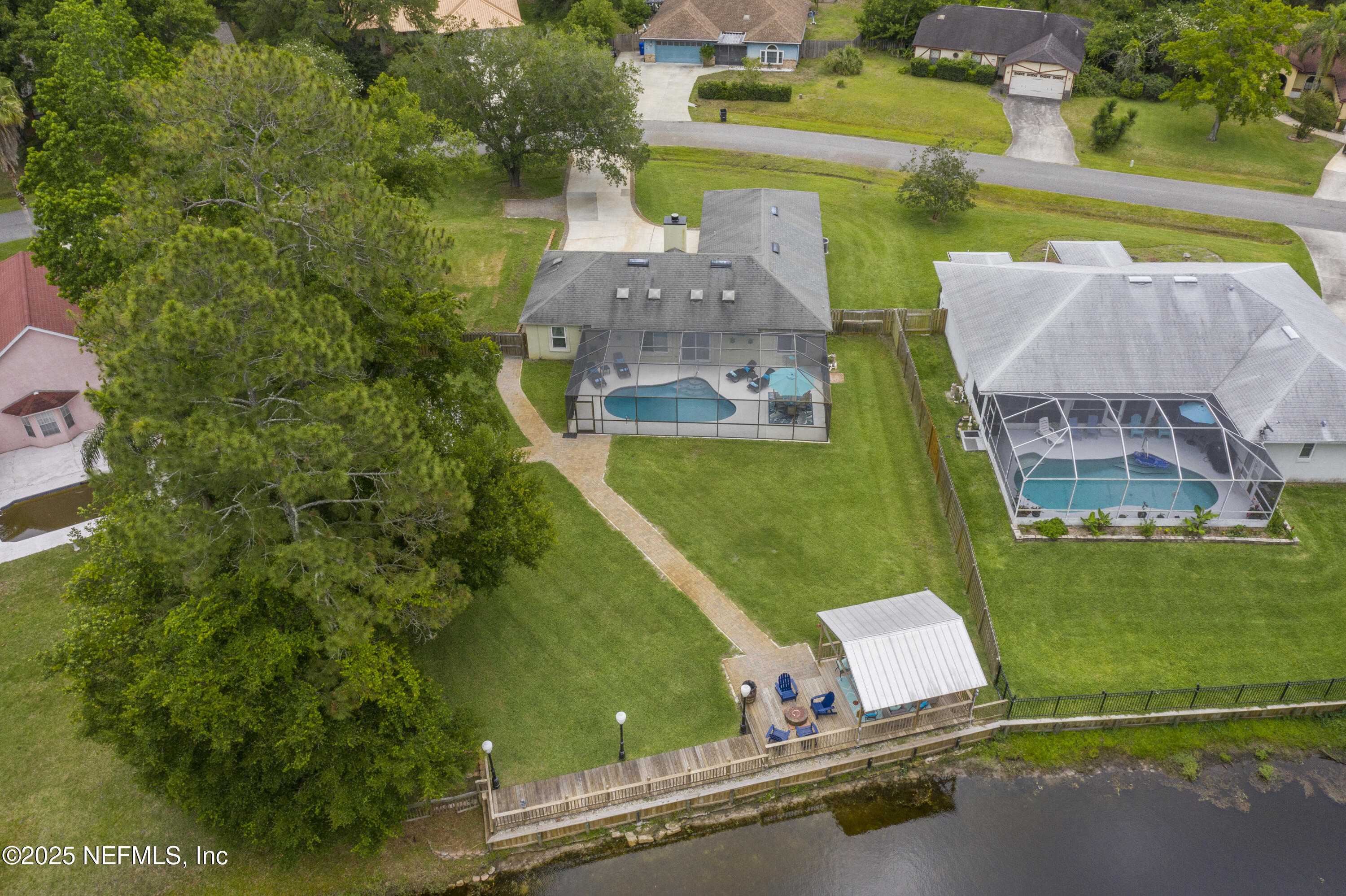 4041 Pine Run Circle St. Augustine, FL 32086 - Photo 9 of 57 an aerial view of a house with a garden and lake view