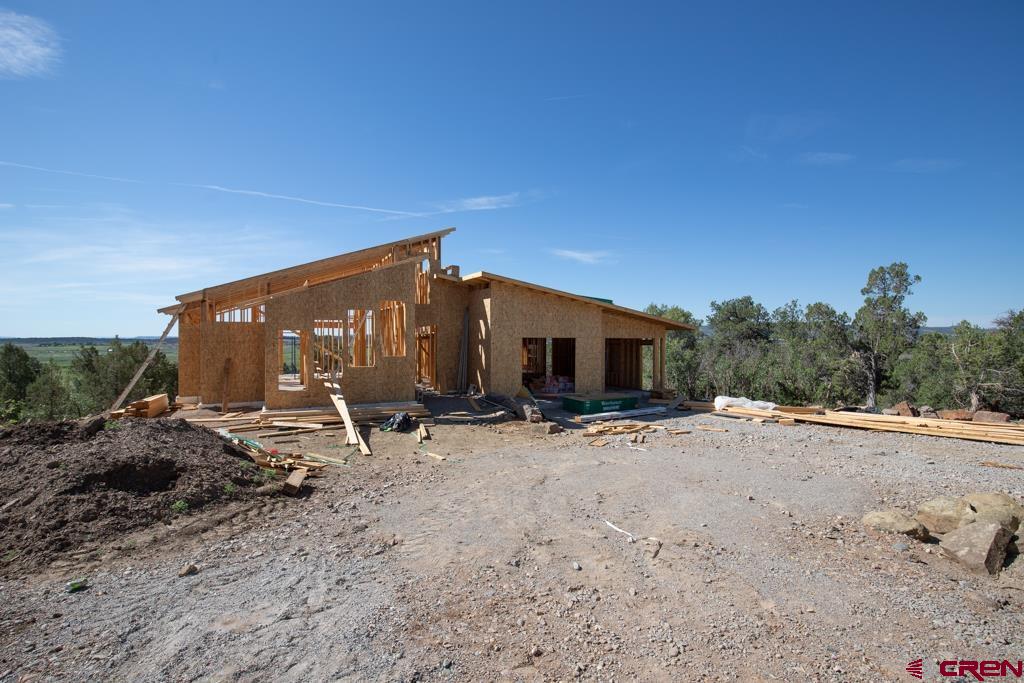 149 Rustic Ridge Ignacio, CO 81137 - Photo 5 of 13 a view of a car park in front of a house