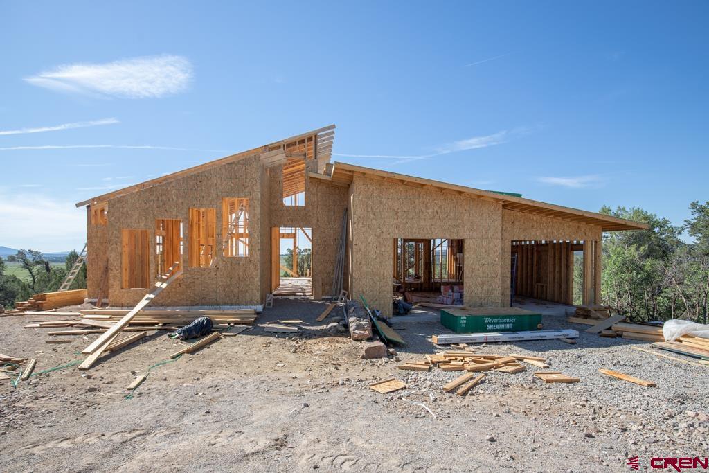 149 Rustic Ridge Ignacio, CO 81137 - Photo 6 of 13 a front view of a house with a yard